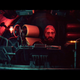 A man sits in a dark submarine.